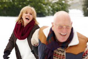 Smiling couple outside in winter